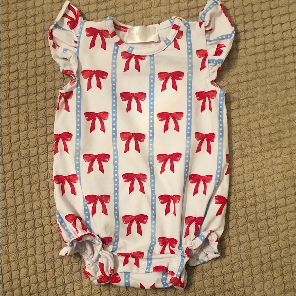 Cecil and Lou One-Piece Bodysuit with Red Bow Print